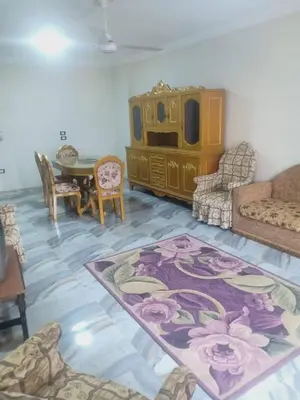 a living room with a couch and a table at الريف فيلا in Ar Ramthā