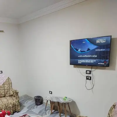 a flat screen tv hanging on a wall at الريف فيلا in Ar Ramthā