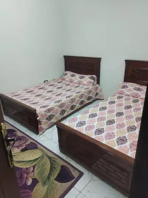 two beds sitting next to each other in a room at الريف فيلا in Ar Ramthā
