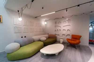 a living room with a couch and chairs at Hill Top Hotel in Aqaba