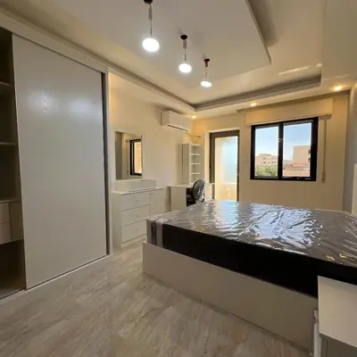 a bedroom with a large bed in a room at اربد in Irbid