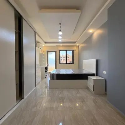 a bedroom with a bed in a room at اربد in Irbid