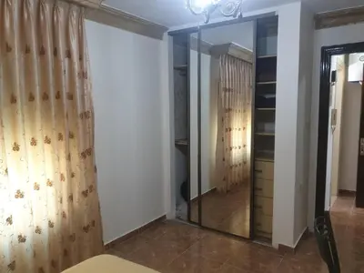 a dressing room with a mirror and a closet at الاردن عمان تلاع العلي شارع ابو يوسف الأنصاري اسكان طارق الشيخ in Amman