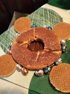 a brown cake sitting on top of a table at النعيمه هاوس in An Nu‘ayyimah