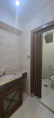 a bathroom with a shower and a sink and a toilet at الريان غرفتين نوم in Amman
