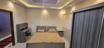 a bedroom with a bed in a room at الريان غرفتين نوم in Amman