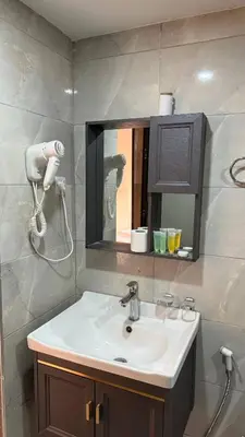 a bathroom with a sink and a mirror at Tarf Wadi Rum Luxury Camp & Jeep Tours in Wadi Rum