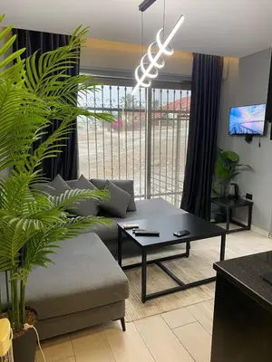 a living room with a couch and a table at beautiful apartment in the DeadSea in Sowayma