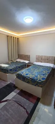 two beds sitting in a room with at ام النعمان شليت in Umm as Surab