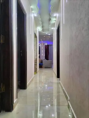 a hallway with a room with a couch and a hallway with a hallwayngthngth at رحيق الزخور هاوس in Madaba