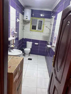 a bathroom with a toilet and a sink at الاغوار bb in Khirbat ash Shaykh Muḩammad