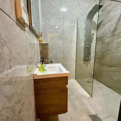 a bathroom with a sink and a shower at Z villas Chalet in Al Rama