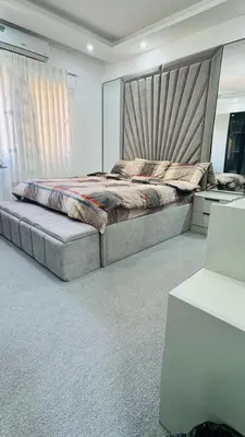 a bedroom with a large bed in a room at شقق فاخره للايجار in Amman