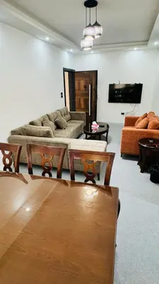 a living room with a couch and a table at شقق فاخره للايجار in Amman