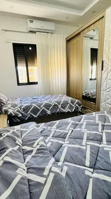 a bedroom with a large bed in a room at شقق فاخره للايجار in Amman