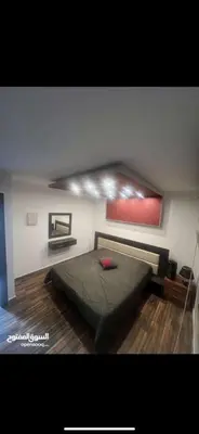 a bedroom with a large bed in a room at Apartment in Al Jafr