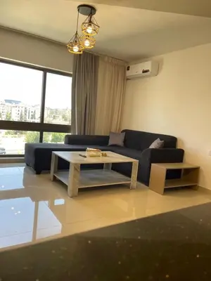 a living room with a couch and a coffee table at 2bedroom aprt at 7th circle f-r4 in Amman