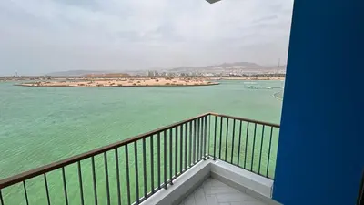 a balcony with a view of a body of water at Ayla Aqaba Azure 2 bedroom in Aqaba
