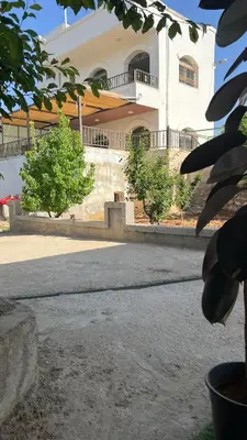 an empty street in front of a building at شاليه جبال سوف in Jerash