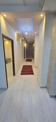 an empty hallway with a rug on the floor at الريان in Amman