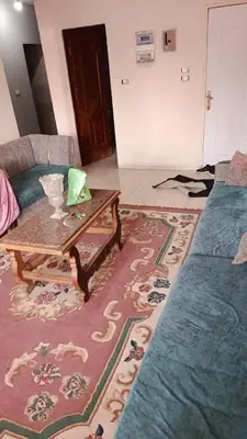 a living room with a coffee table and a couch at ام جوزه هاوس in Umm Jawzah