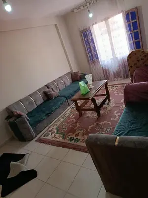 a living room with a couch and a coffee table at ام جوزه هاوس in Umm Jawzah