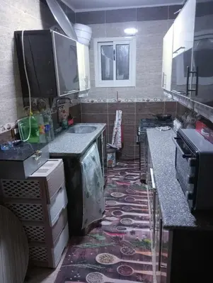 a kitchen with a sink and a counter top at ام جوزه هاوس in Umm Jawzah