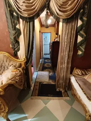 a hallway with a room with curtains and a doorway at الزواهره هاوس in Az Zarqa