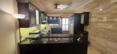 a kitchen with a counter top in a room at شقة مفروشة في طبربور 3 غرف نوم in Amman