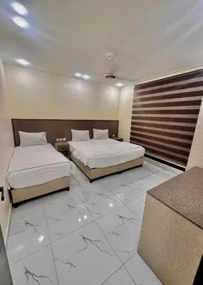 two beds in a hotel room with two beds sidx sidx sidx at Old Town Hotel in Aqaba