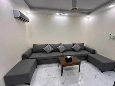 a living room with a couch and a table at Old Town Hotel in Aqaba
