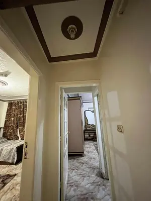 a room with a ceiling and a room with a bed at سونا موتل in Sūf