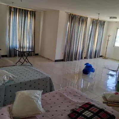 a room with two beds and a blue object on the floor at New Room in Aqaba