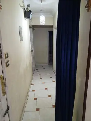 a hallway with a blue curtain in a room at فلورس لوج