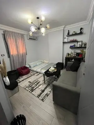 a living room with a couch and a table at الضليل هاوس in Abū Ghārah