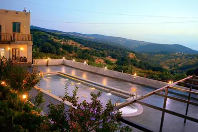 a swimming pool with a view of a mountain at Mountain Oak Chalet شالية ملول الجبل in Al Jafr