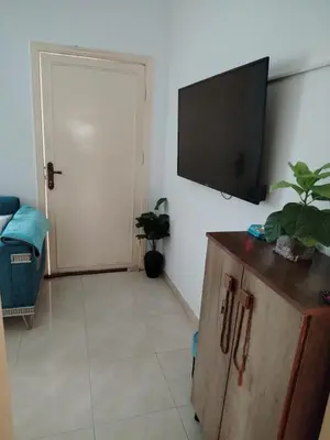 a living room with a flat screen tv on a wall at العقبة in Aqaba