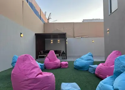 a group of pink and blue bean bags on the ground at SunValley in Al Rama