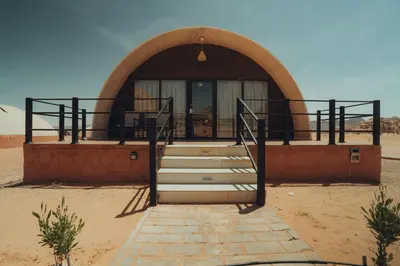 an entrance to a building in the desert at Moon night camp in Disah