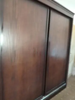 a pair of wooden doors in a room at ام الينابيع عجلون in Ajloun
