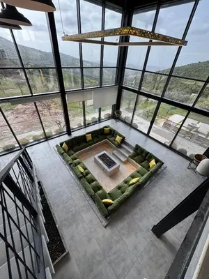 an overhead view of a living room with a couch at AlFahed Farm in Ajloun