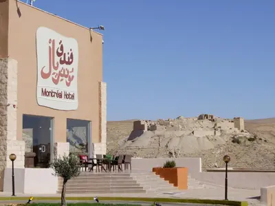 a building with a sign that reads morocco like with a castle in at فندق مونتريال الشوبك in Al Jāyah
