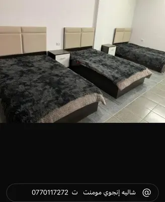 two beds in a room with two beds sidx sidx sidx at Enjoy moment chalet