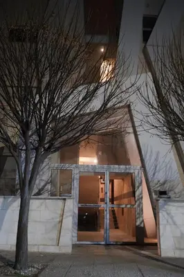 a building with a glass door and a tree at Luxury Roof-top in Amman