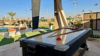 a ping pong table in the middle of a pool at Giving City in Amman