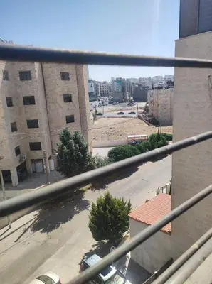 a view of a city street from a building at Amman in Amman