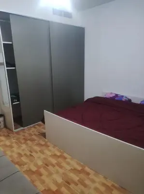 a bedroom with a bed and a mirror at Amman in Amman