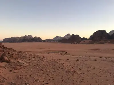 a view of the desert with rocks in the background at Wahj Ram camp in Aqaba