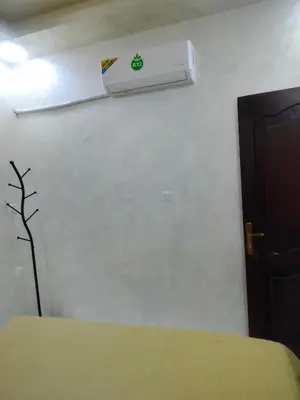 a room with a wall with a air conditioner on the wall at Ayla Furnished Apartments in Aqaba
