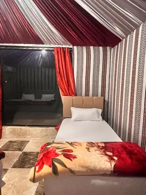 a bedroom with a bed in a tent at Layla Wadi Rum in Disah